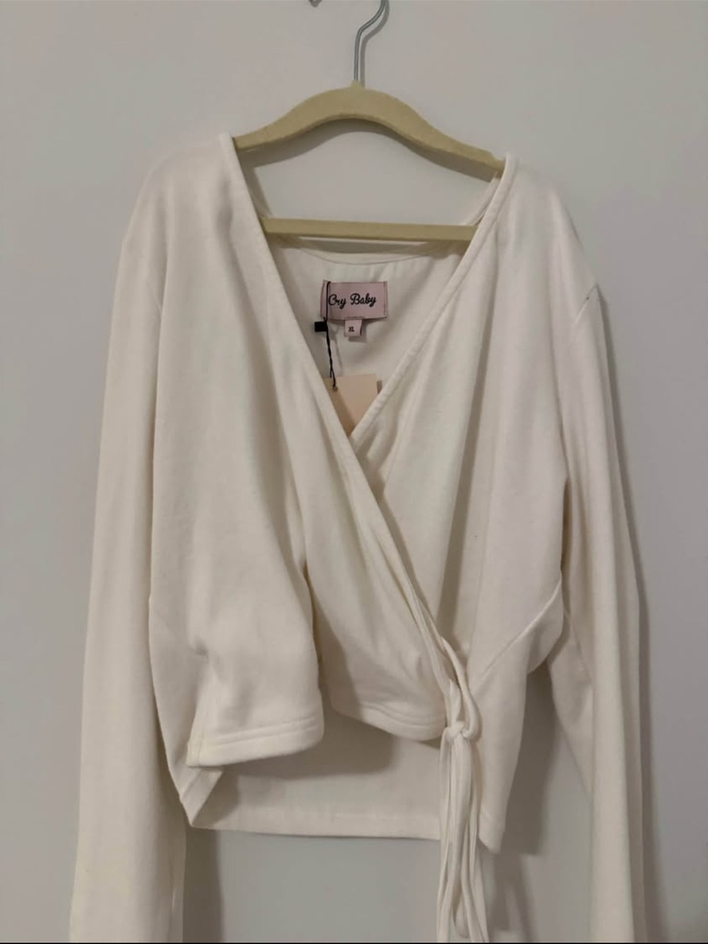 Cozy Cream Wrap Tie-Front Top by Cry Baby